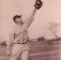 E.J. Cassell stretches out holding a baseball in his glove