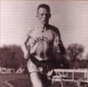 Higdon runs a race on an outdoor dirt track