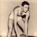 Rosenblum leans down to dribble the basketball