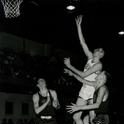 Grimm jumps past the defense to make a shot in basketball
