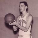 Armacost holds the basketball in front of his chest