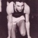 Herman kneels at the start of the track