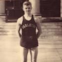 Taylor poses in his basketball uniform outside of Sayles-Hill Campus Center
