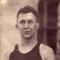 Young poses for a headshot wearing a Carleton tank top