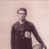 Alfred Robertson stands with a basketball under his arm