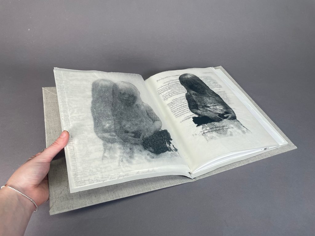 handmade book with printed illustrations and handwritten text