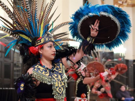 A dancer in a traditional costume at Carleton's annual Dia de los Muertos celebration