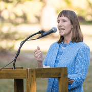 President Byerly speaking at a podium outdoors