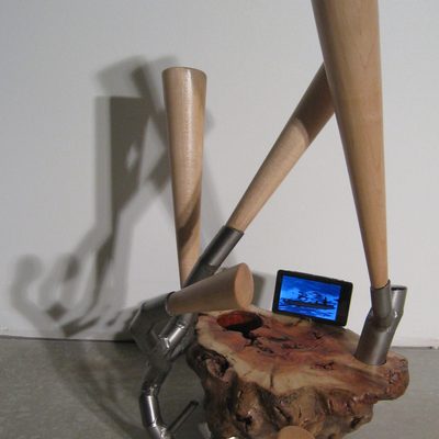 Abstract sculpture made of wood, steel and video display