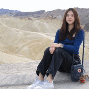 Liya Guan sitting on a rock