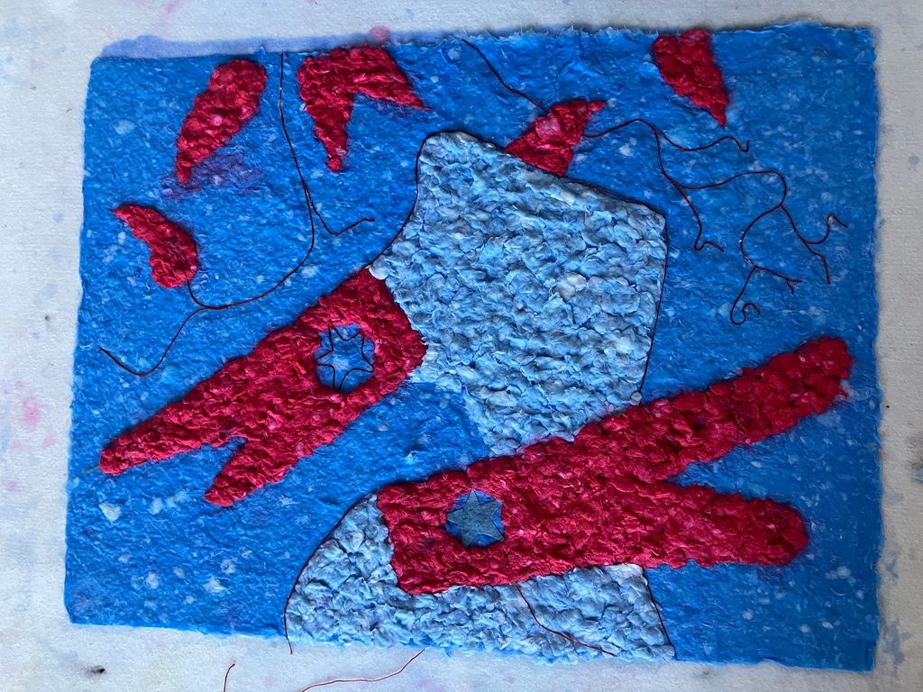 Sculptural artwork made of handmade paper, buckthorn leaves, string