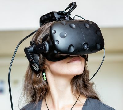 A young woman wearing a virtual-reality headset