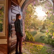Photo illustration: A student look out a doorway containing a magical landscape with butterflies and topiary