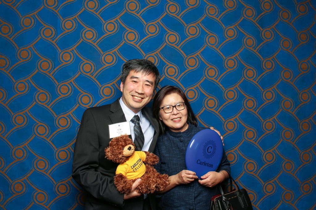 A couple pose in a photo booth