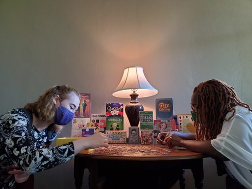 Julia and Octavia work on the puzzle.